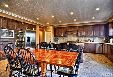 Huge gourmet kitchen with stainless steel applianc