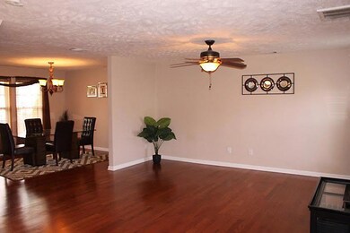 View from great room to dining area.  Beautiful hardwood floors throughout downstairs