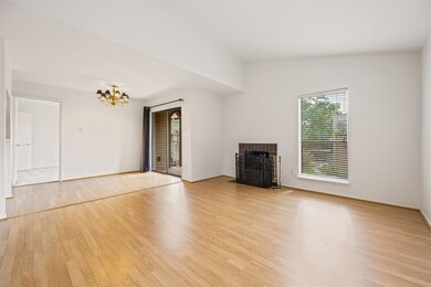Bright living area with high ceilings, laminate wo