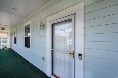 Property entrance with covered porch