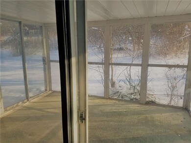 Enclosed patio with view to back yard. The sliding