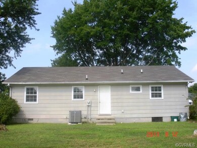 Rear of home showing new heat pump.