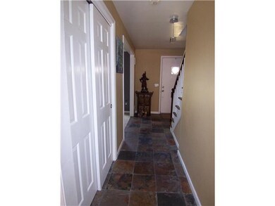 Foyer. Hall to foyer with slate flooring.