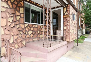 Concrete covered front Patio leads into mudroom.