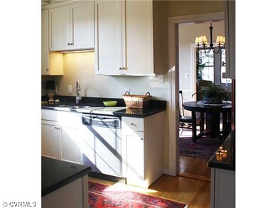 Kitchen - The kitchen features cream cabinets, dar