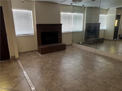 Unfurnished living room with tile patterned floors