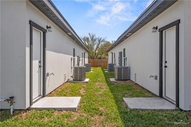 View of yard with fence and central air condition unit