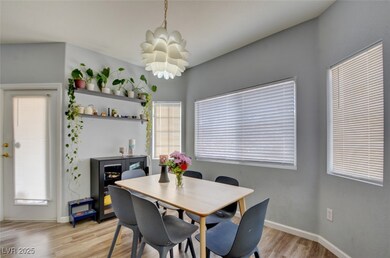 Dining area with light hardwood / wood-style floor