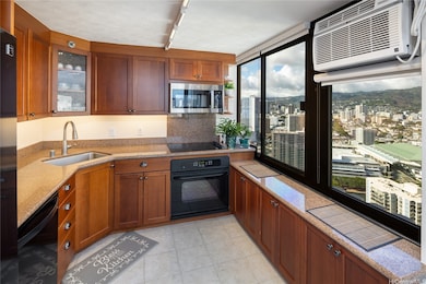 Kitchen with mountain and city views to the right.