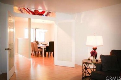French doors to living room have stained glass des