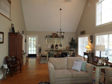 Open Living And Dining Room With Beautiful Hardwoo