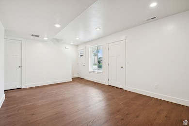 Entryway featuring hardwood / wood-style floors and recessed lighting