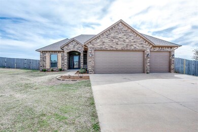 View of front facade featuring a front lawn and a 