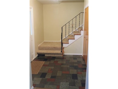 Spacious slate entry with large coat closet (right