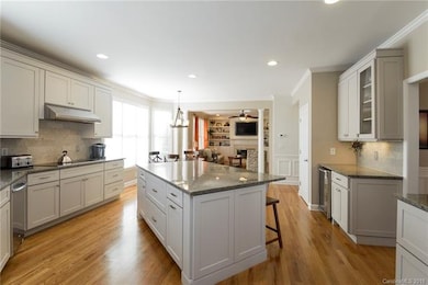 Updated kitchen features beautiful white cabinetry