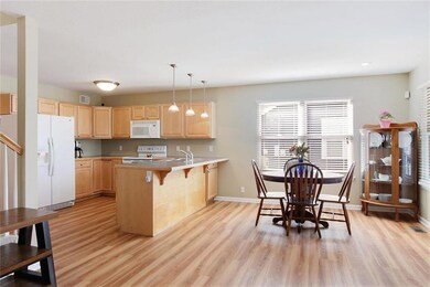 Open kitchen, dining, and living room welcome you 