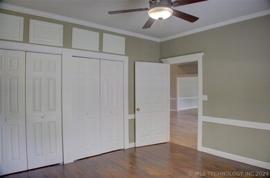 A wall of closets gives lots of storage space in t