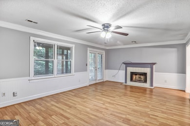 Features fireplace and ceiling fan