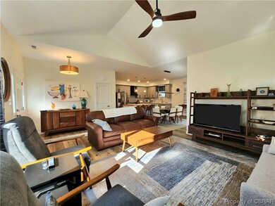 Living room with dark hardwood / wood-style floors
