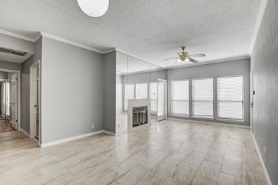 Unfurnished living room with crown molding, baseb