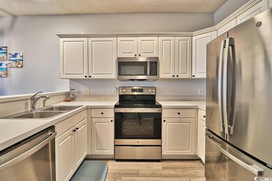 New stainless steel appliances (fridge features in