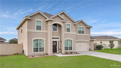 View of front of home featuring stucco siding, driveway, and an attached garage