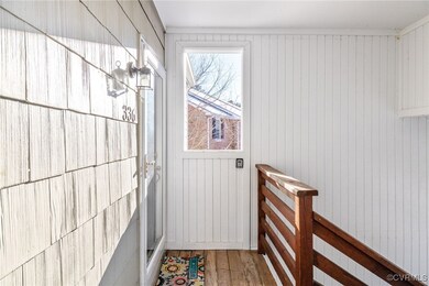 Doorway to outside featuring hardwood / wood-style