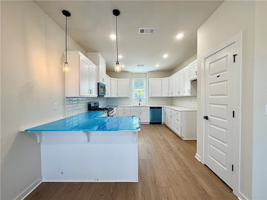 The quartz countertops, walk-in pantry, and stainl
