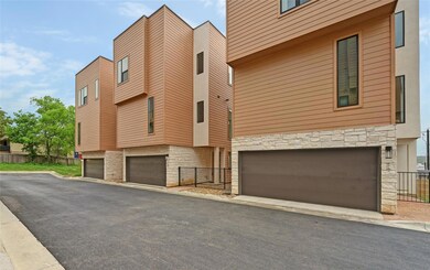 View of building exterior with an attached garage