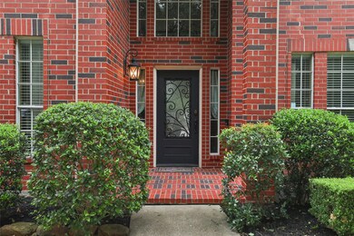 Fresh landscaping and a covered porch.