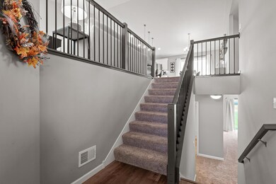 Inviting entry with open staircase and coat closet