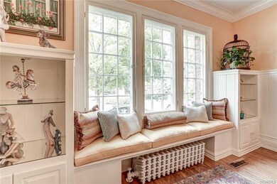 Living Room has window seat and built-in bookshelves.