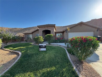 Ranch-style home with stucco siding, a garage, a f