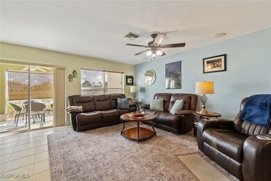 Tiled living room with ceiling fan