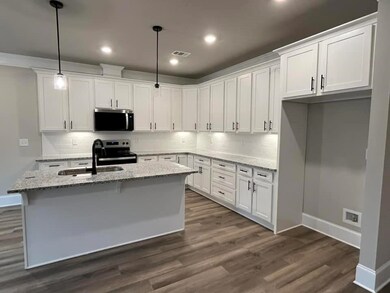 Kitchen featuring a sink, stainless steel applianc