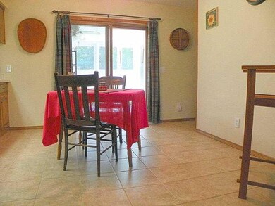 Dining Room. Very comfortable Dining Rm. w/ porcelain tile floor and a counter providing lots of serving space.