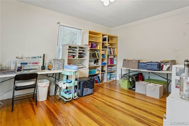 Office space with light hardwood / wood-style floo