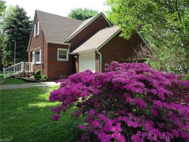 The home is surrounded by beautiful landscaping.