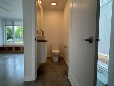 Bathroom with vanity and concrete flooring