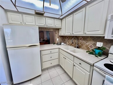 Kitchen with solid surface countertops and stone t