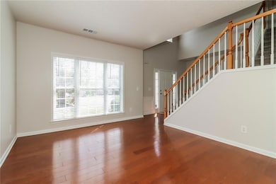 Unfurnished living room with wood finished floors,