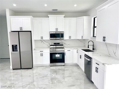 Kitchen featuring appliances with stainless steel