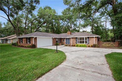Front exterior with a side garage entrance.