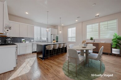 This home boasts with large island, white cabinetr