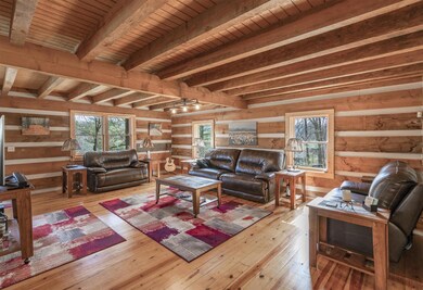 Spacious living room has plenty of room and is open to the kitchen and dining area.