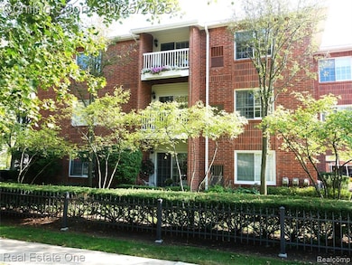View of building exterior with a fenced front yard