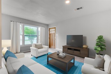 Living room with hardwood / wood-style flooring