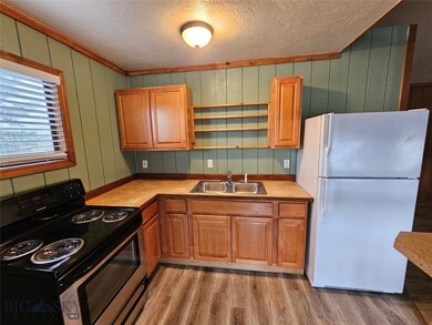 KITCHEN CABINETS SINK AND REFRIGERATOR