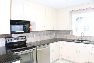 Kitchen with granite countertops, stainless applia