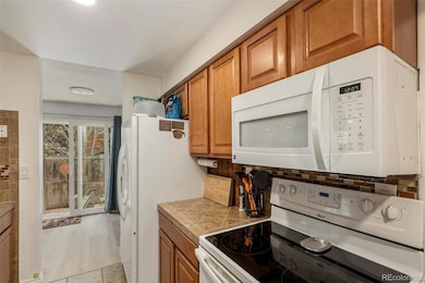 Kitchen flows right to patio doors.
